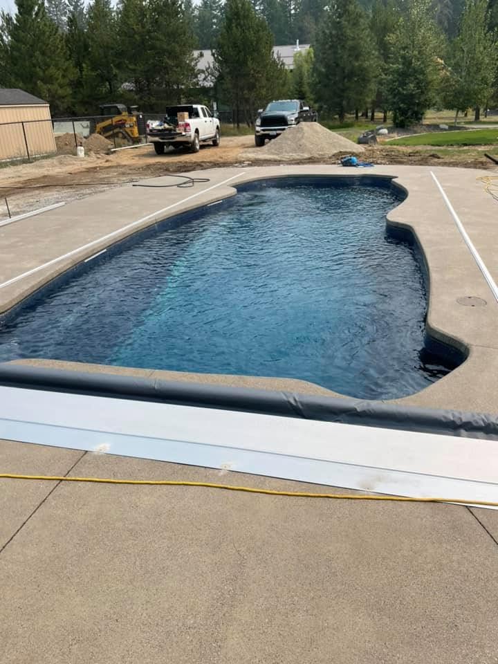 Small backyard fiberglass pool for a Spokane home